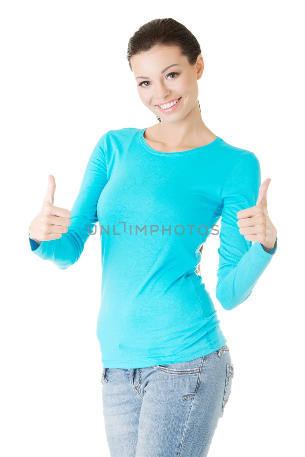 Beautiful young woman in casual clothes gesturing thumbs up.