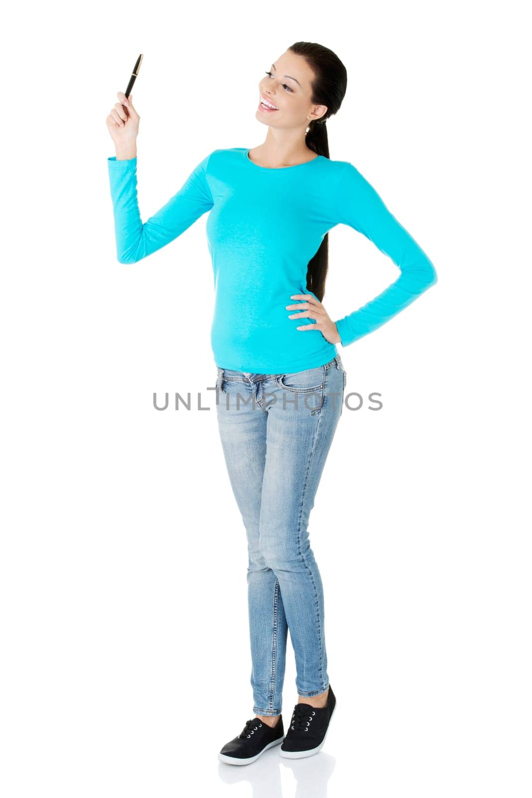 Young student woman writing something on abstract screen