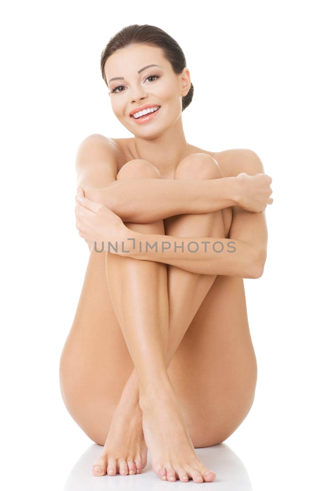 Sexy happy fit naked woman with healthy clean skin, isolated on white background