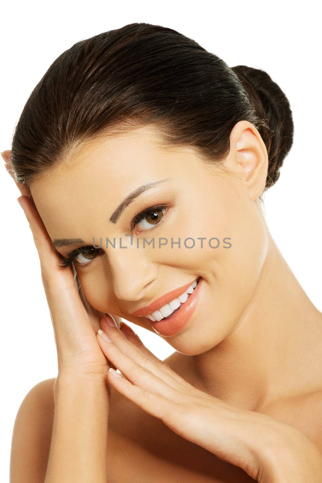 Close-up portrait of young beautiful woman face on white background