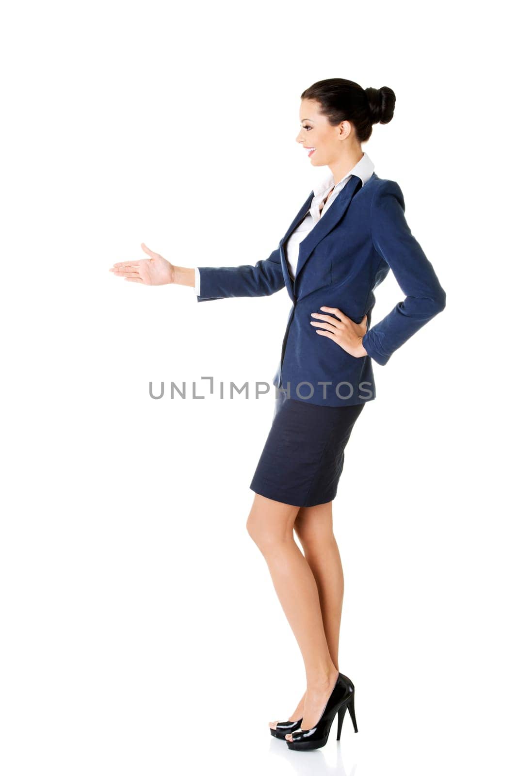 A beautiful businesswoman about to shake hands. Isolated on white