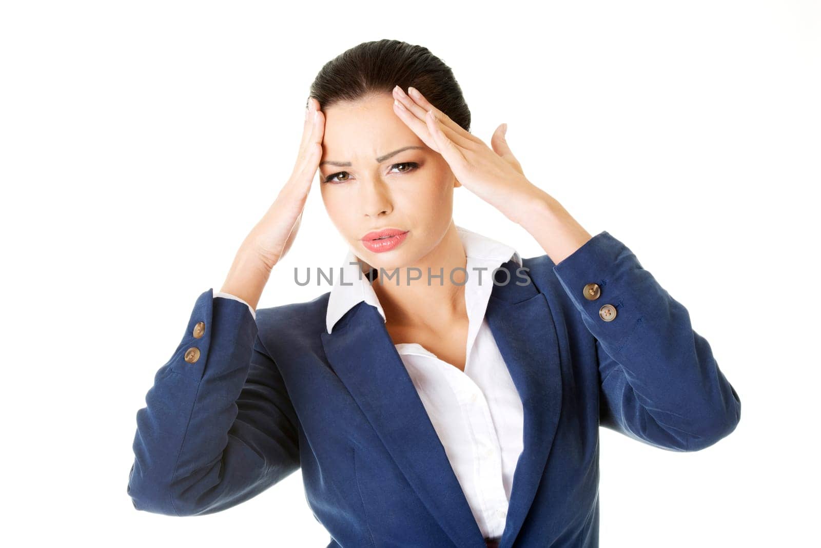 A businesswoman with a headache holding head, isolated on white background