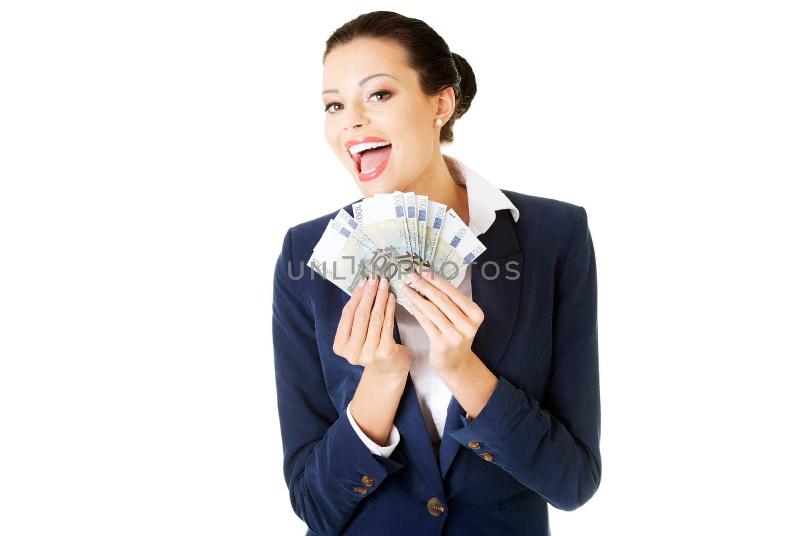Happy attractive businesswoman holding euros