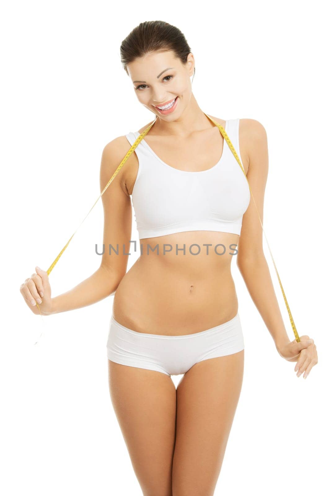 Pretty smiling woman with measurement type - isolated on white