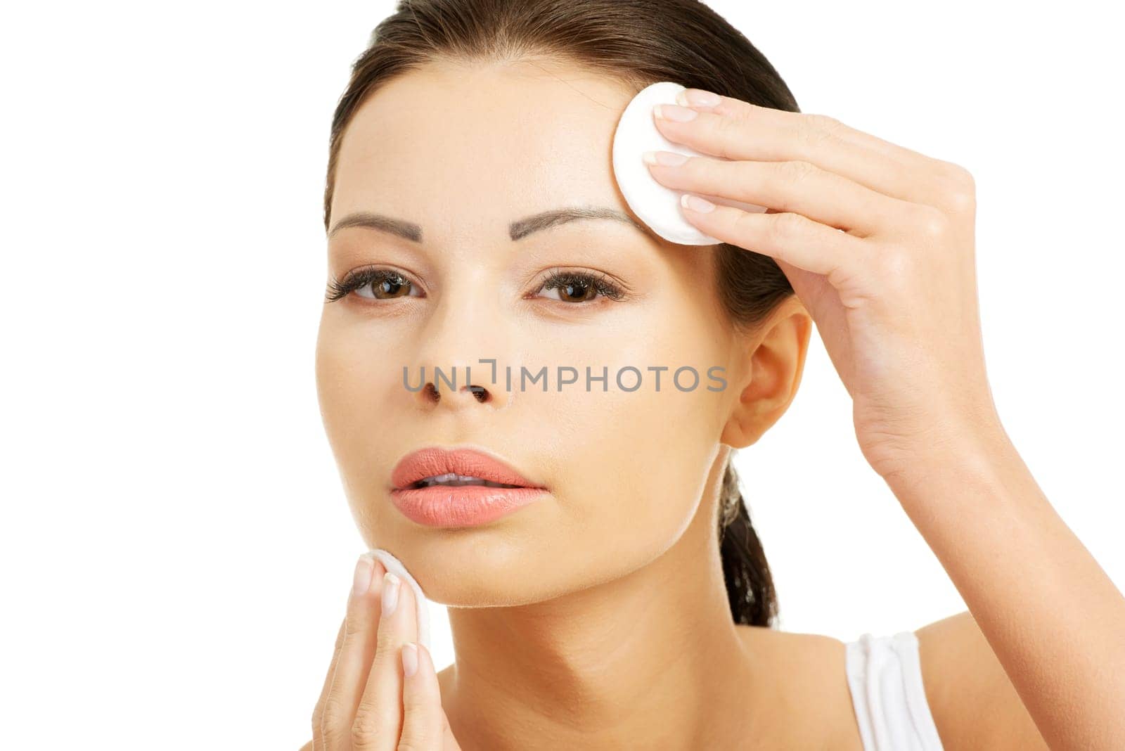 Beautiful woman with cotton pad , isolated on white
