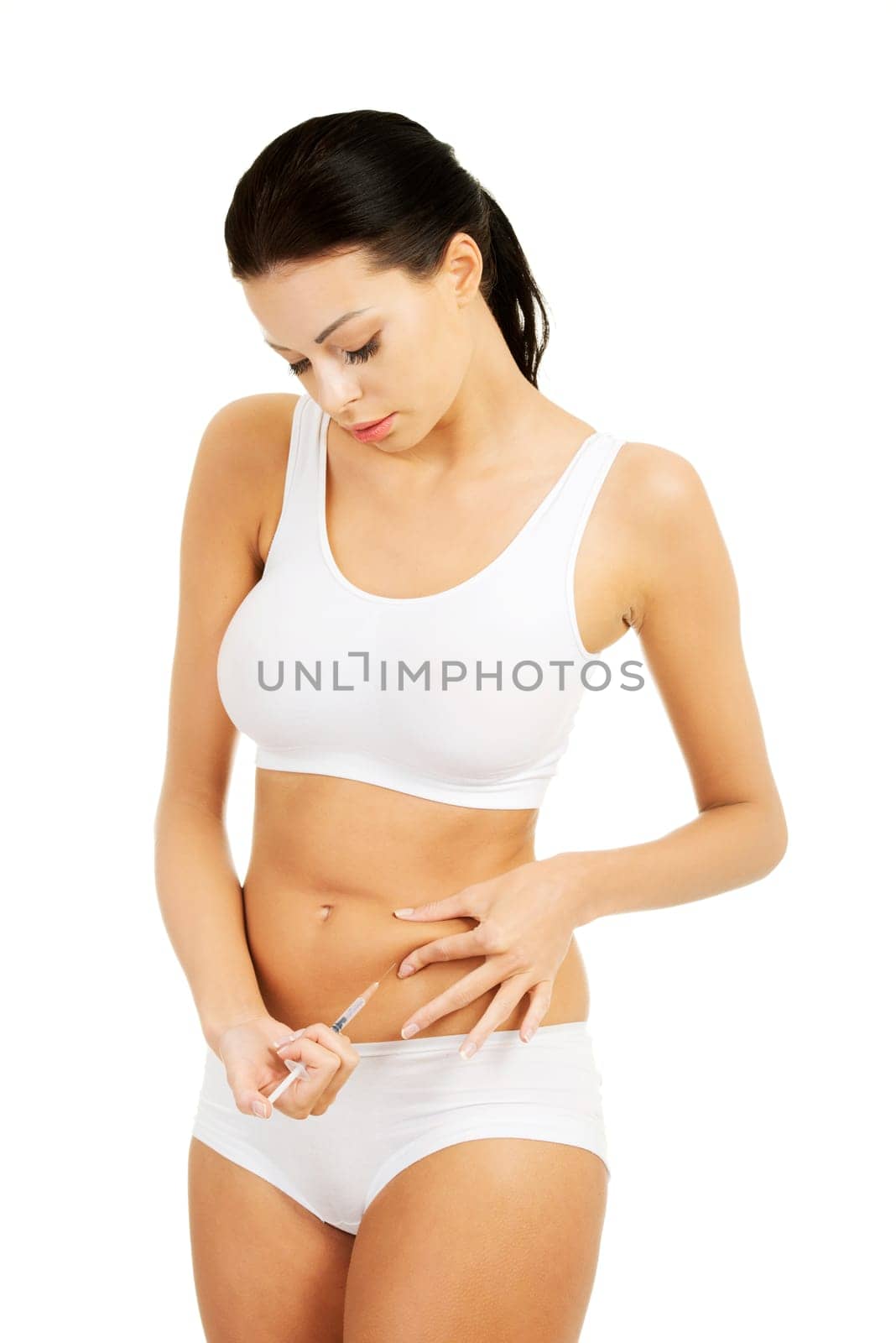 Diabetes woman patient make an abdomen subcutaneous syringe insulin injection with needle