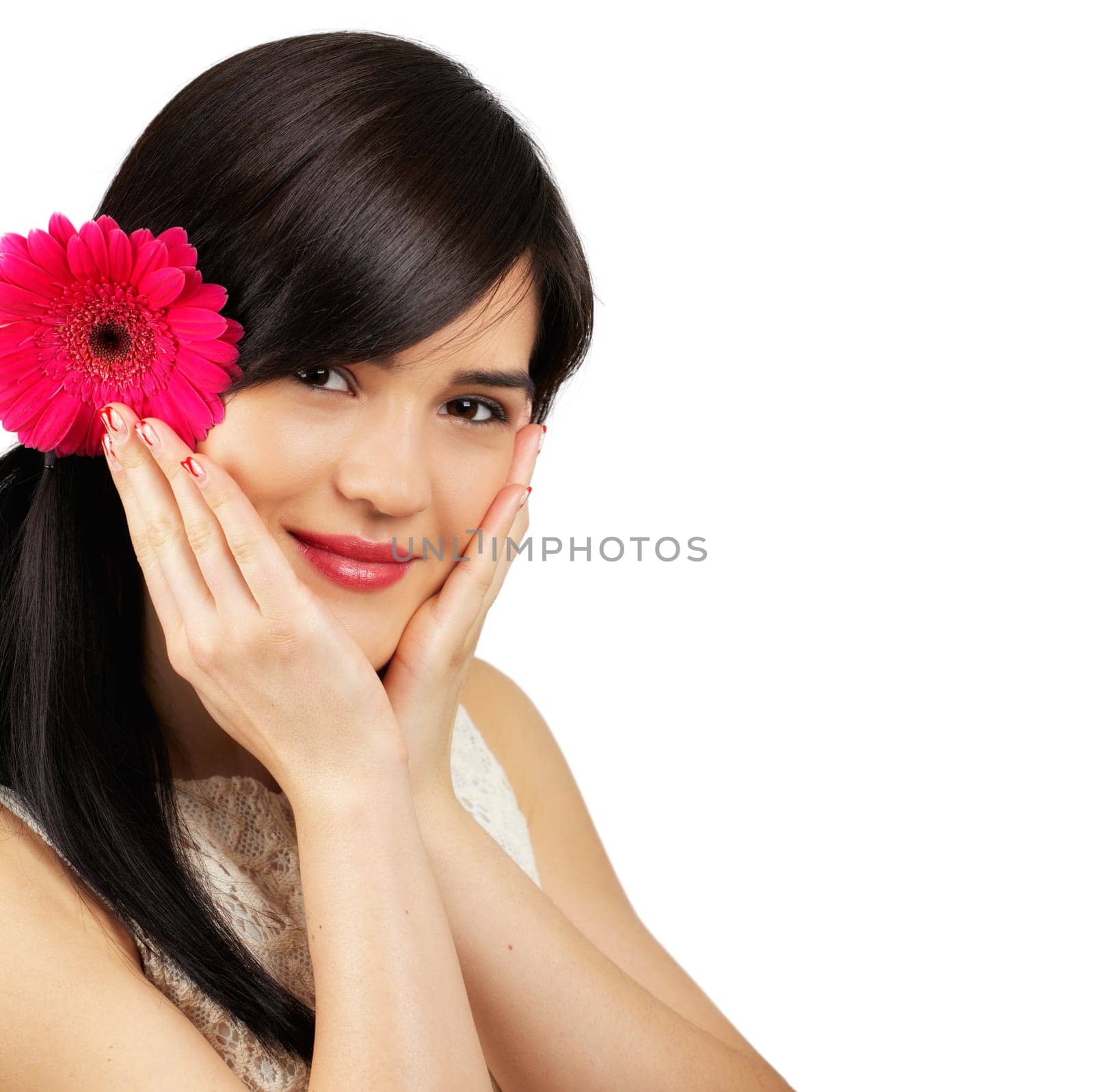 Portrait of a beautiful young woman with a flower in her hair isolated on white.
