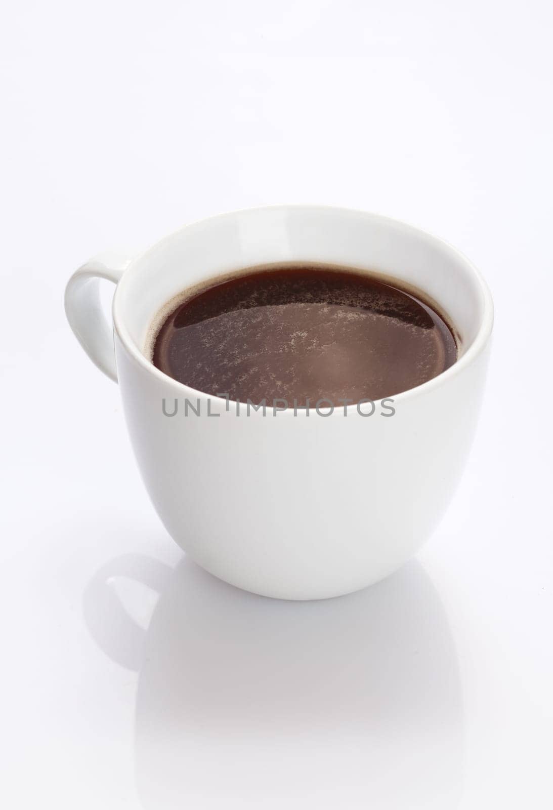 Plain white china cup of hot fresh strong black coffee on a white background with reflection