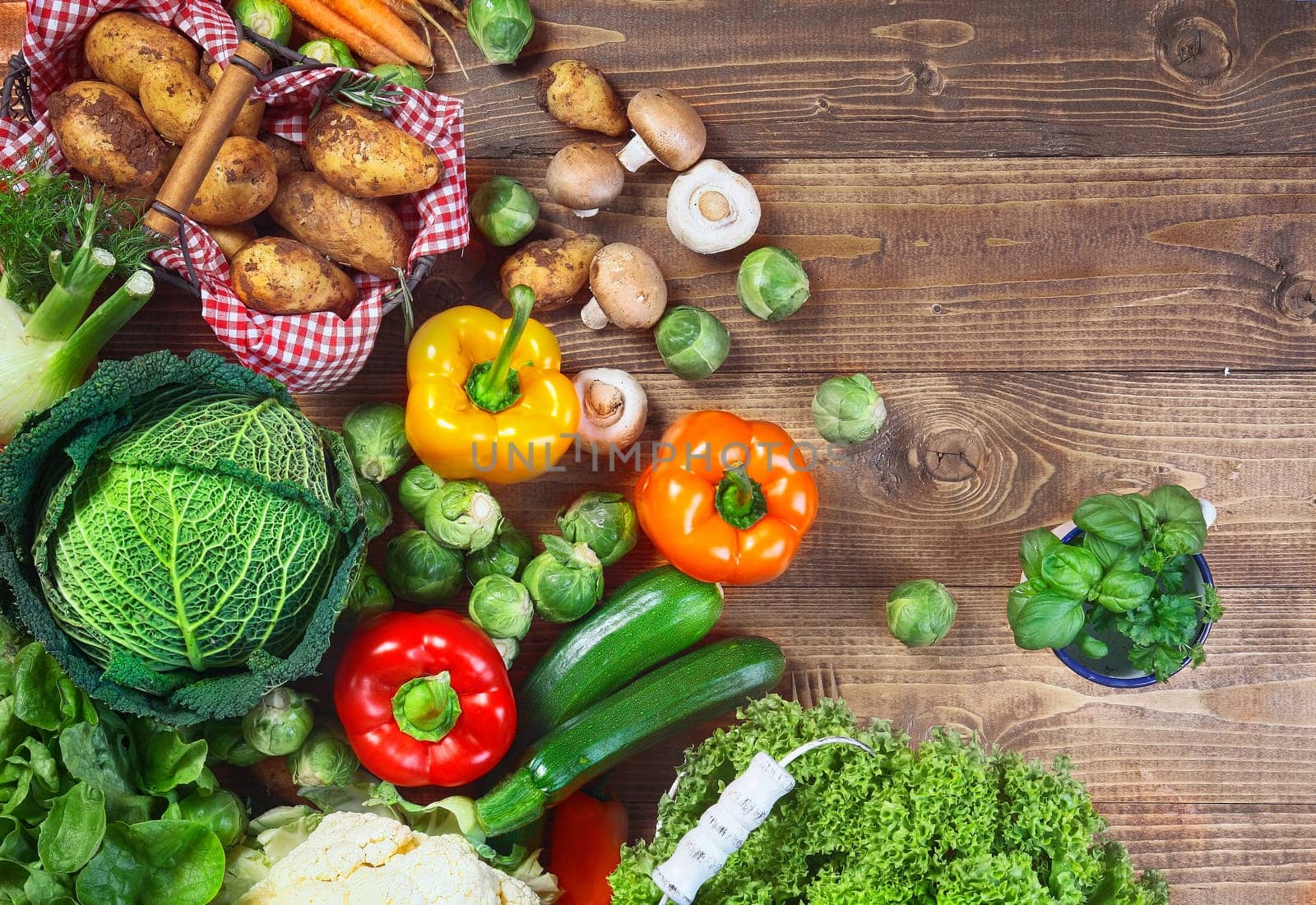 A variety of garden fresh vegetables on wooden table