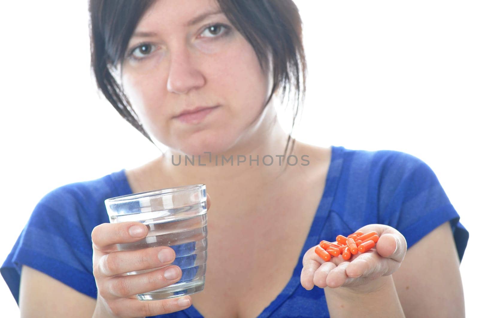 Woman with pill over white background
