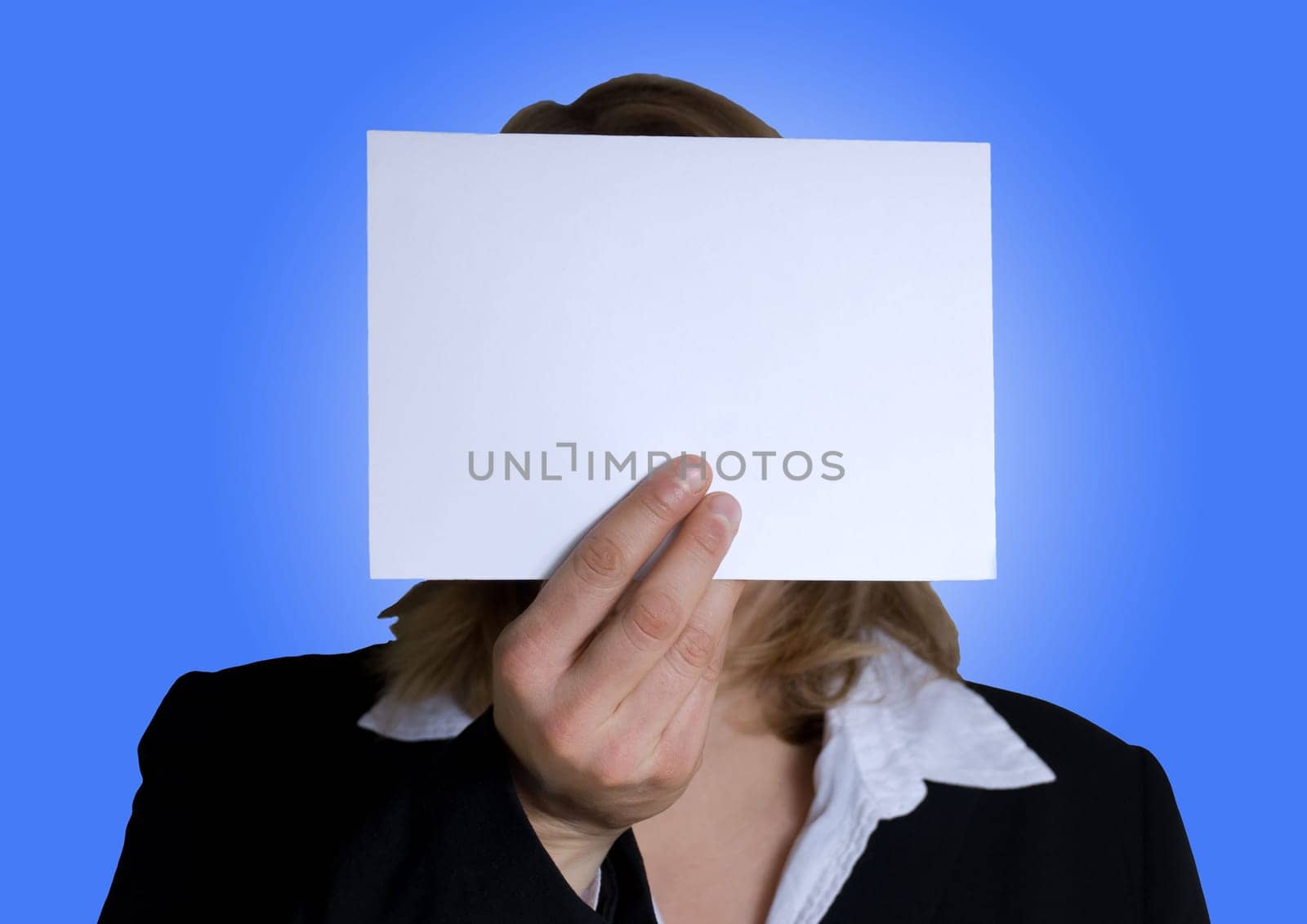 a business person holding a tag with copyspace in front of its head