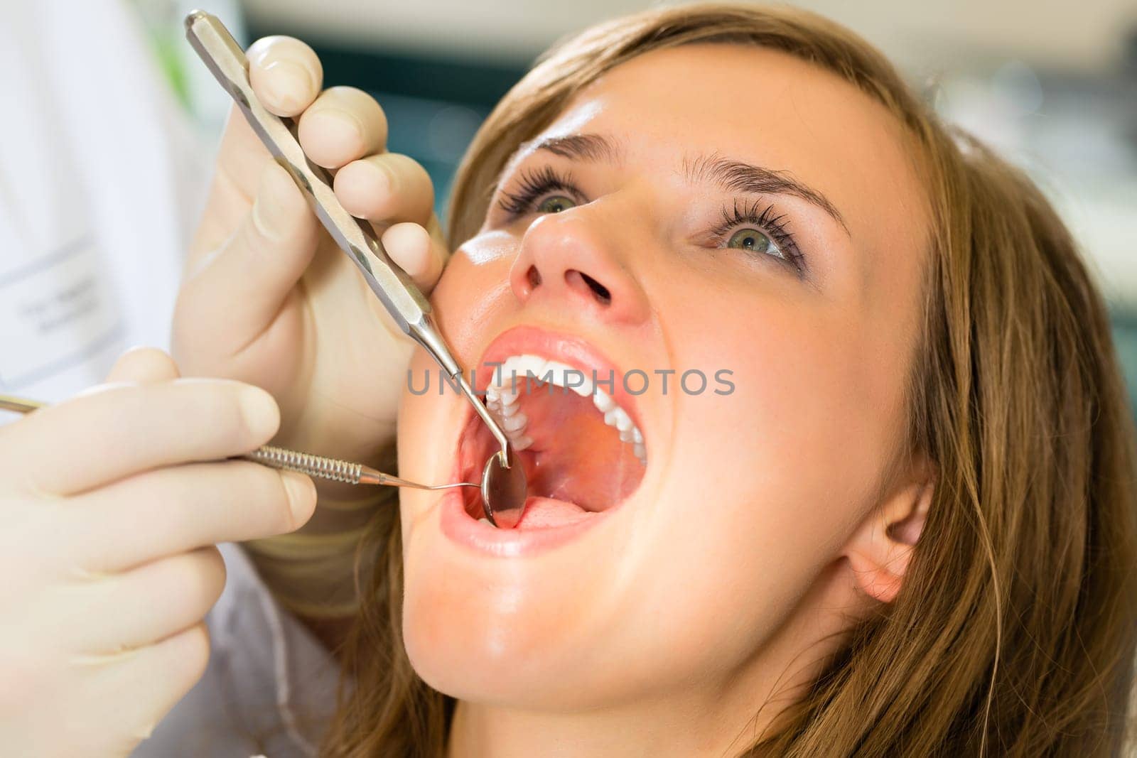 Female patient with dentist during treatment