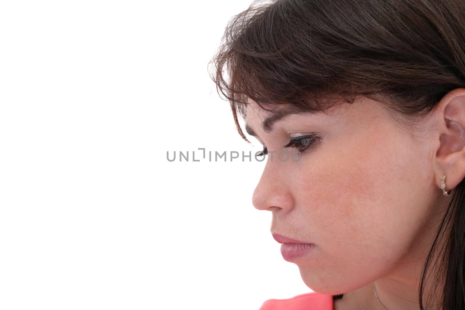 Depressed, sad woman on white background