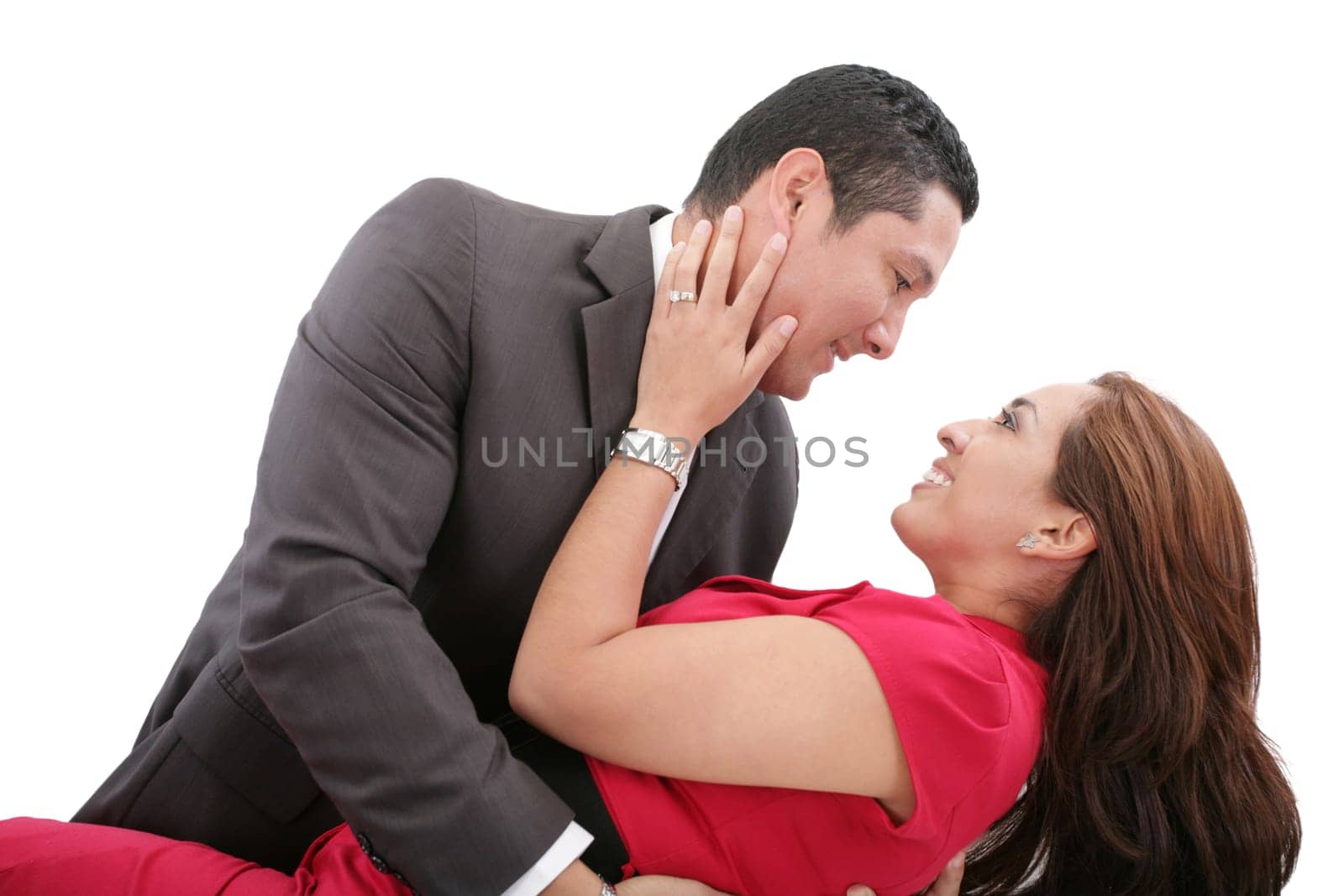 Portrait of a beautiful young happy smiling couple - isolated