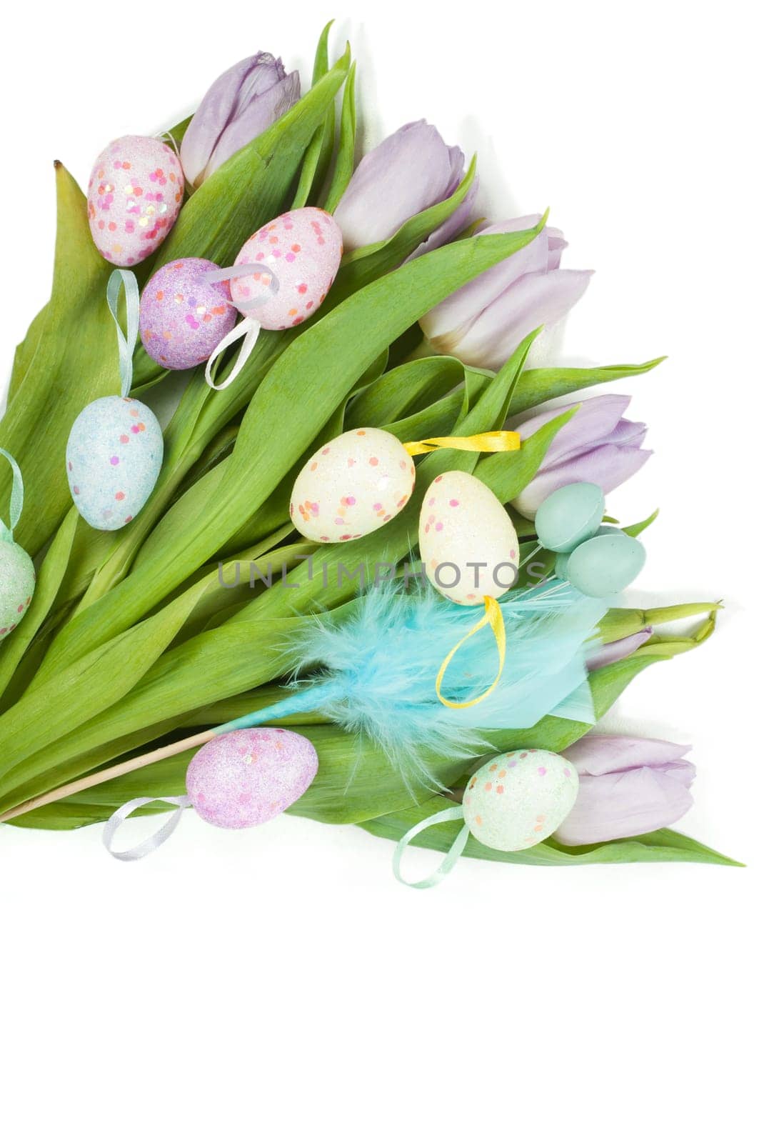 Easter eggs and beautiful tulip bouquet isolated over white