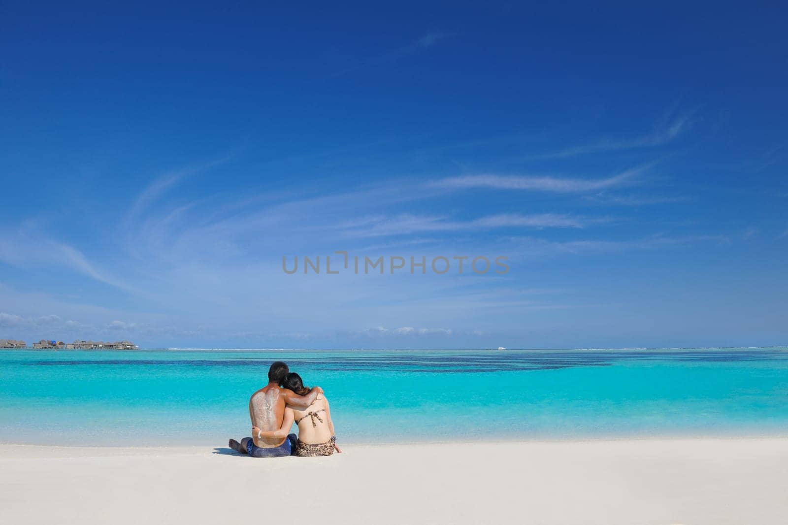 happy young asian couple have fun and romantic time at  summer on beautiful white sand beach