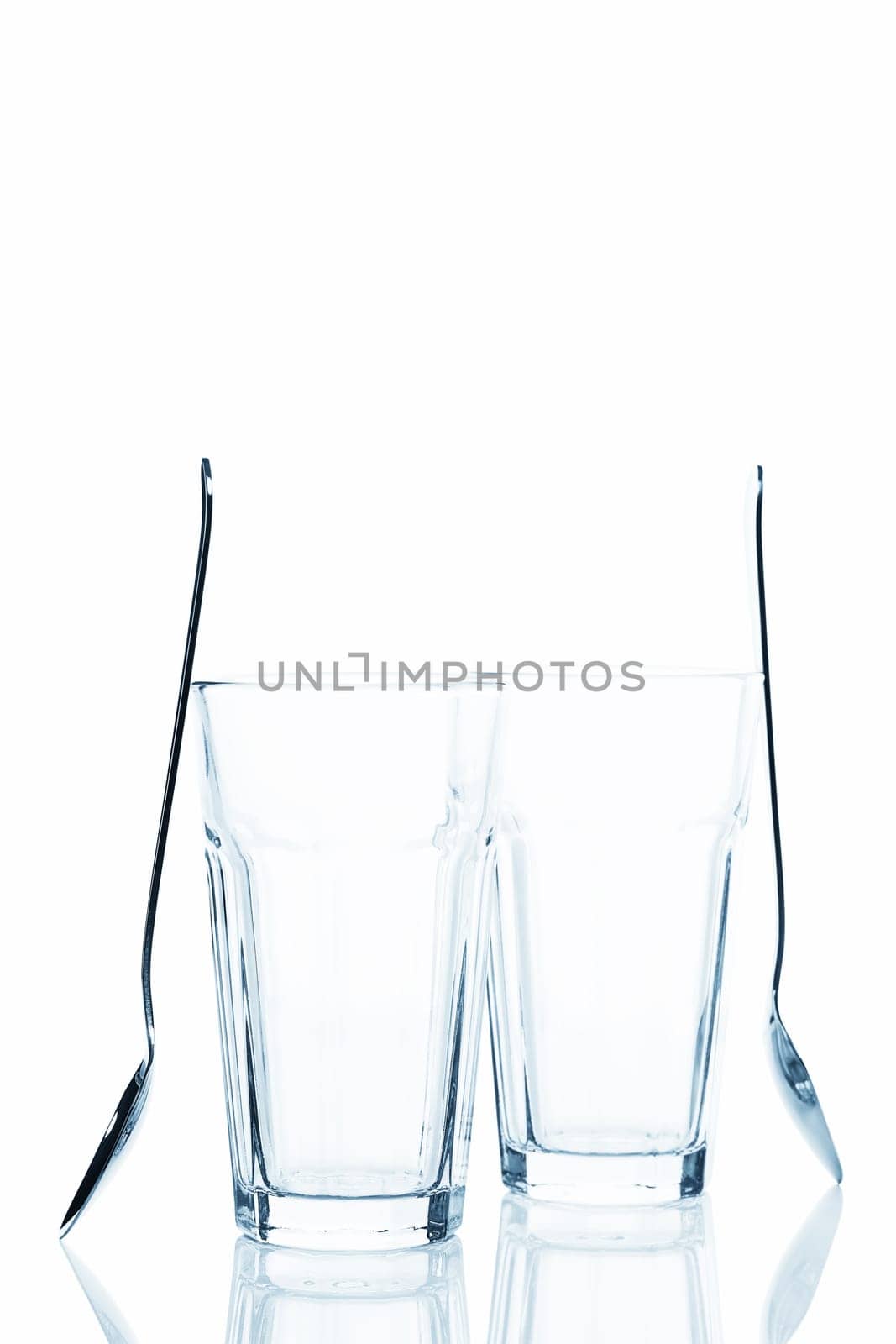 Two empty latte macchiato glasses on white background