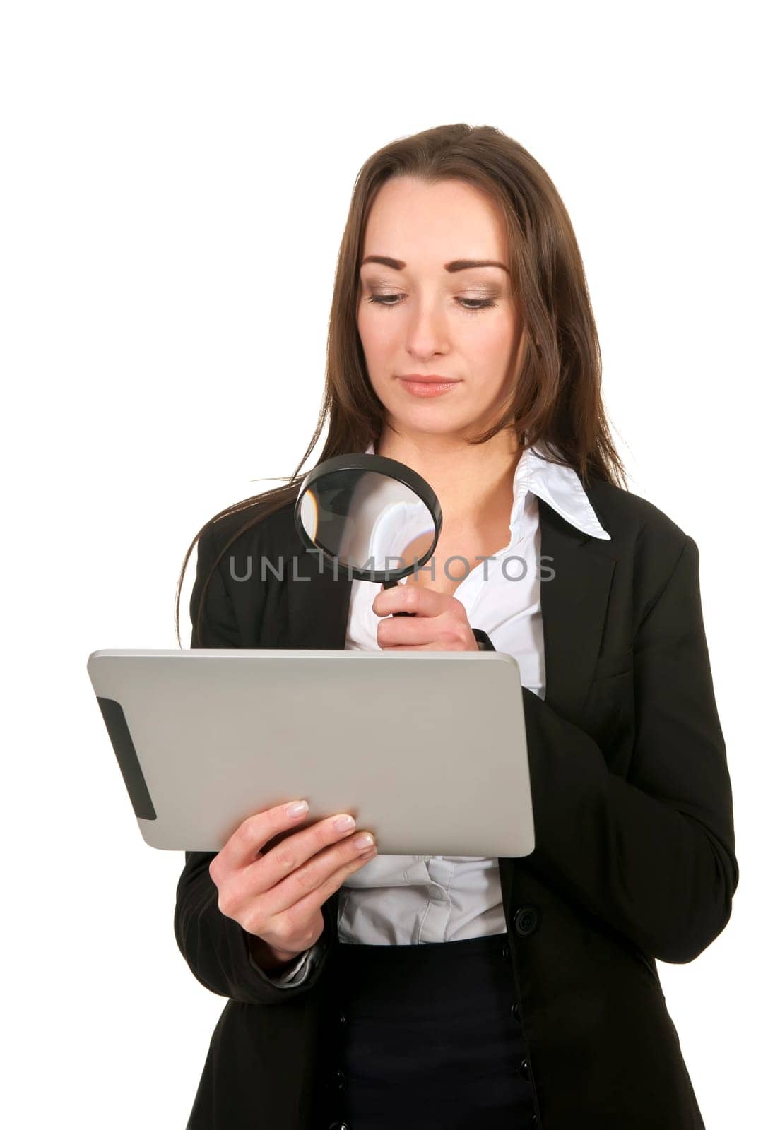 Businesswoman with tablet pc and magnifying glass