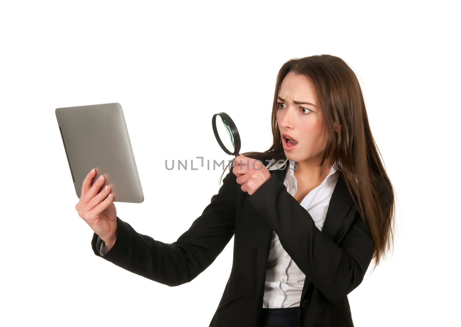 Businesswoman with tablet pc and magnifying glass