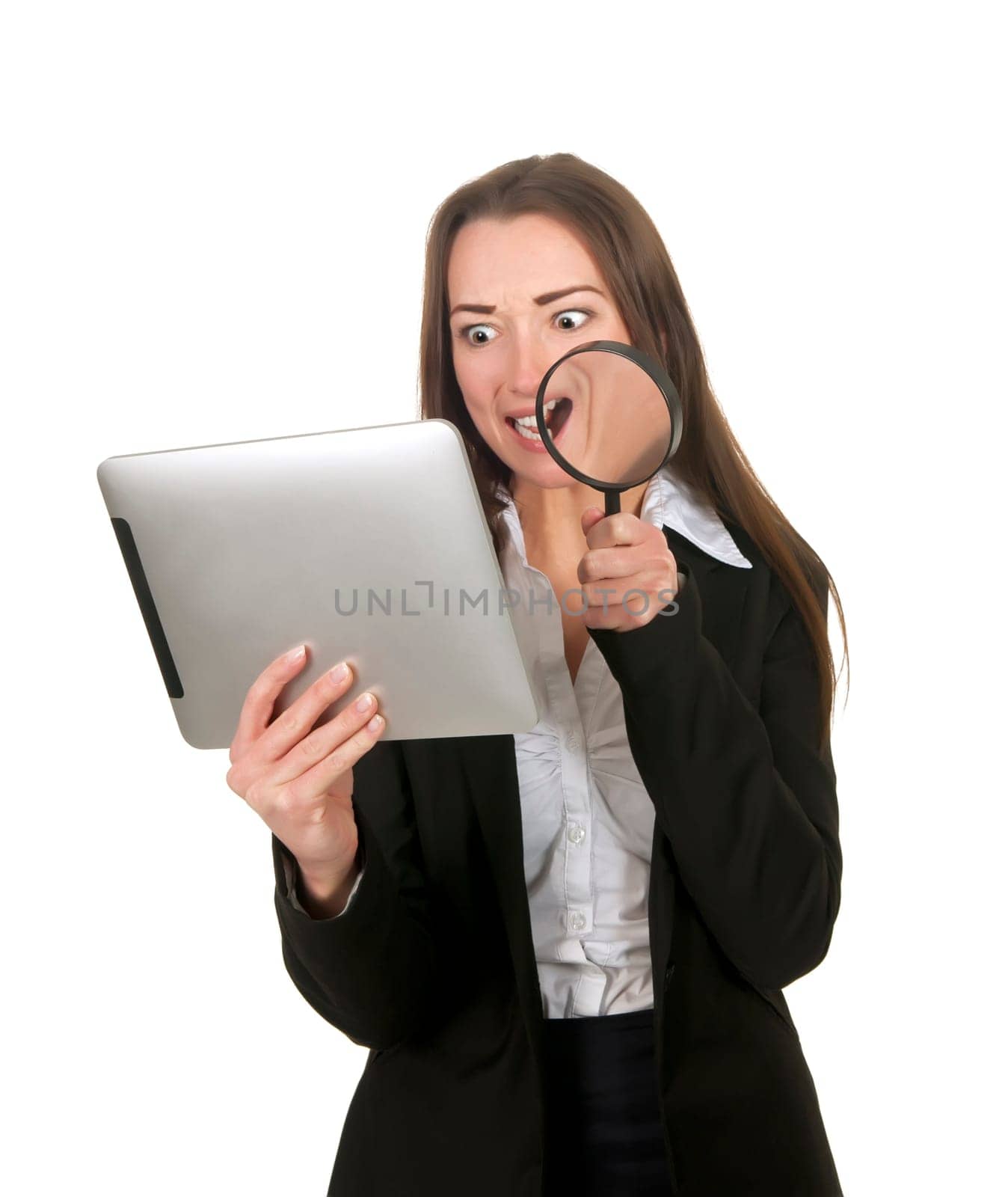 Businesswoman with tablet pc and magnifying glass