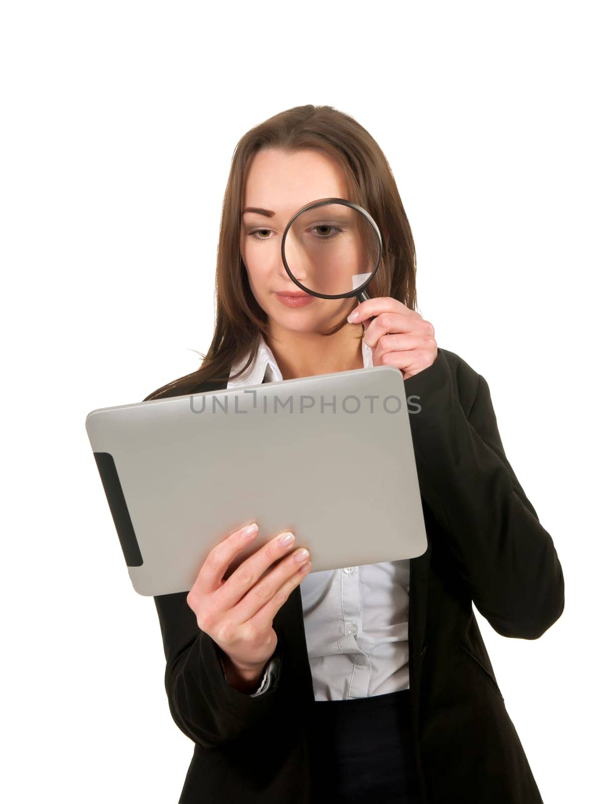 Businesswoman with tablet pc and magnifying glass