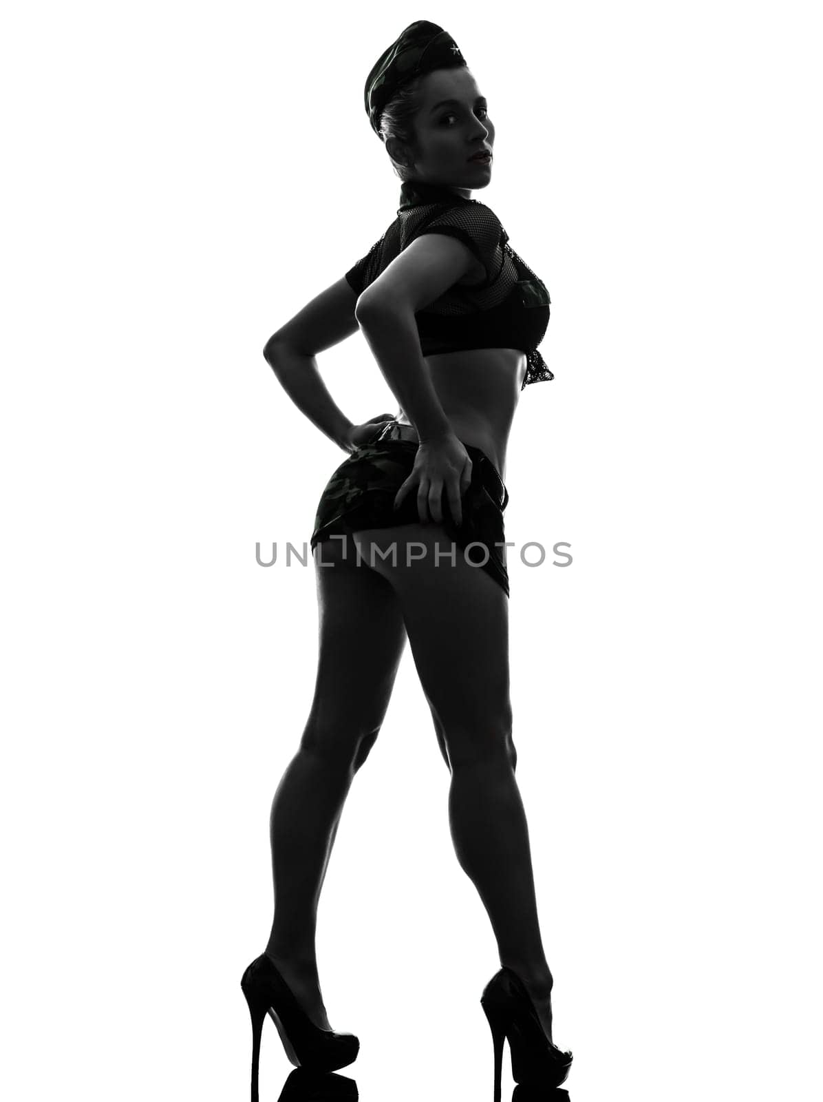 rear view  one caucasian sexy woman in army uniform in silhouette studio isolated on white background