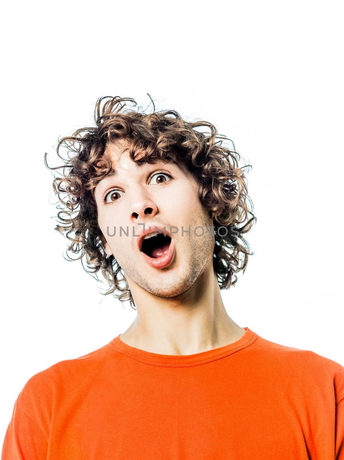 one young man caucasian surprised amazed portrait  in studio white background