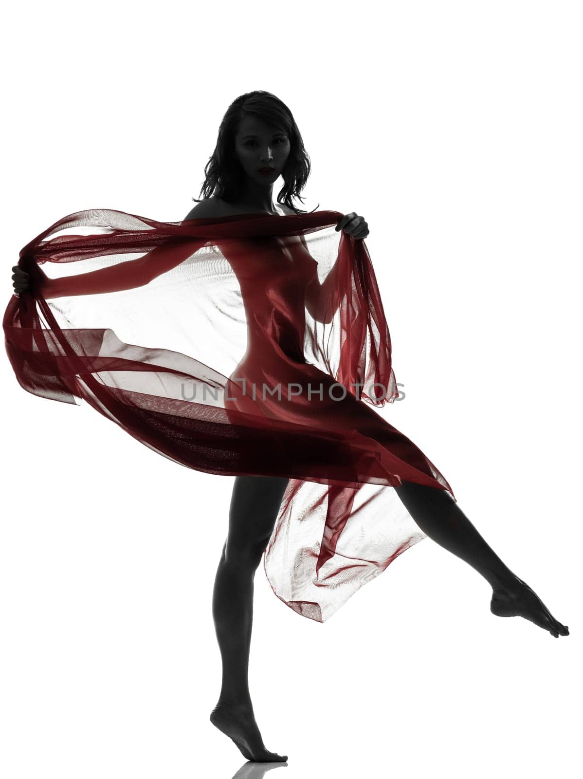 one beautiful asian woman naked behind red veil  in silhouette studio isolated on white background