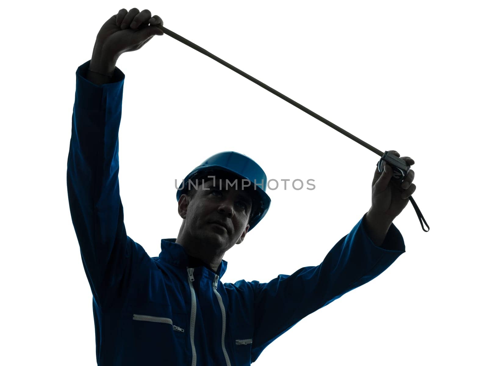 one caucasian man construction worker Tape Measure silhouette in studio on white background