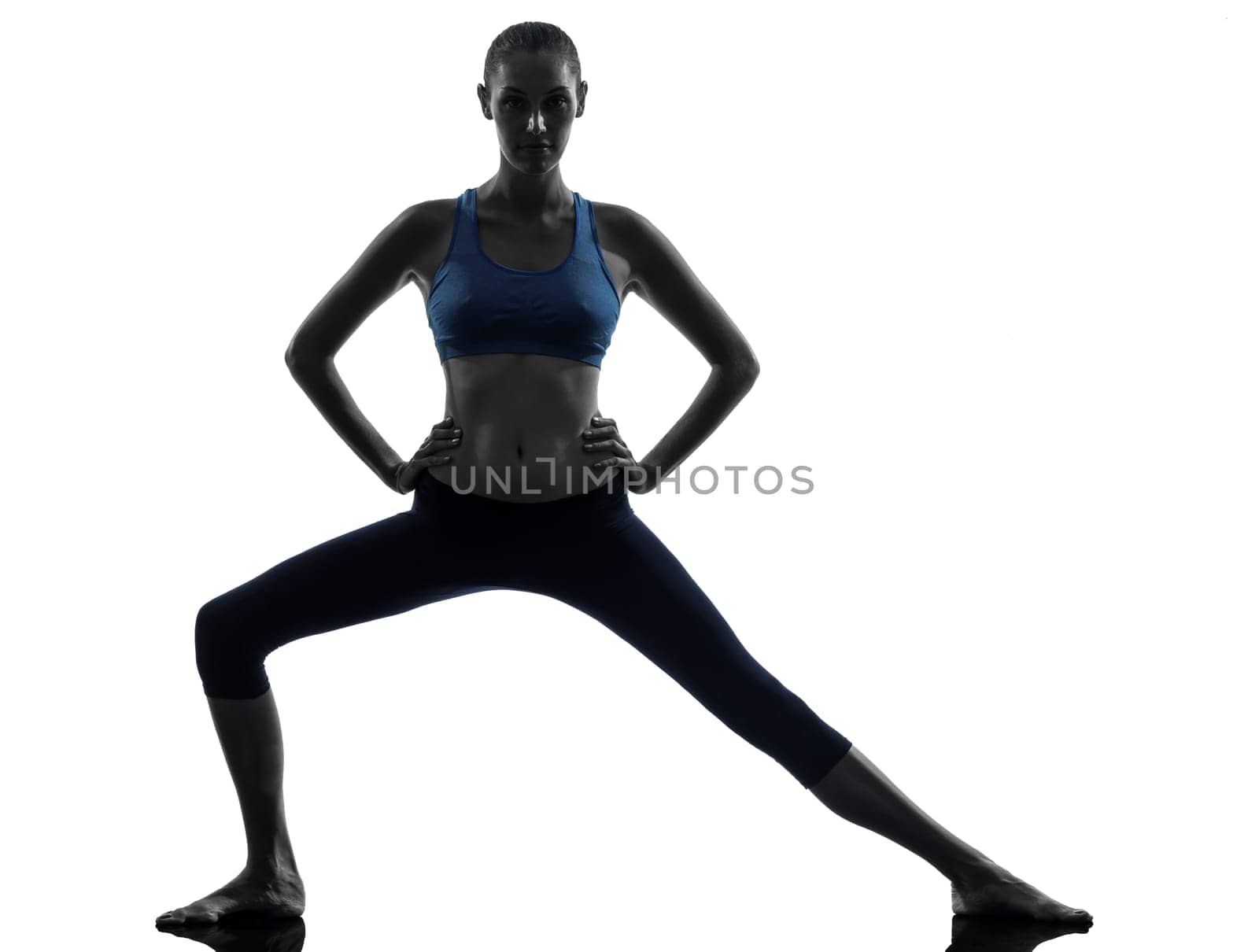 one caucasian woman exercising yoga in silhouette studio isolated on white background