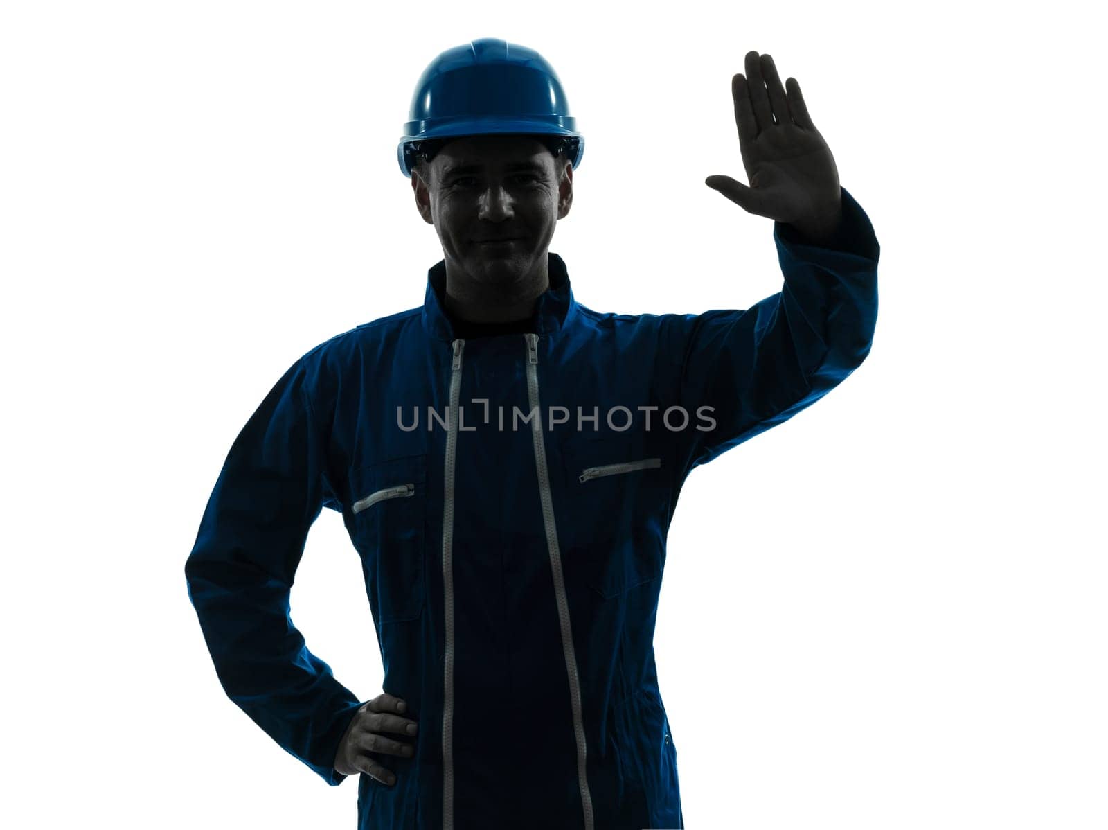 one caucasian man construction worker saluting smiling silhouette portrait in studio on white background