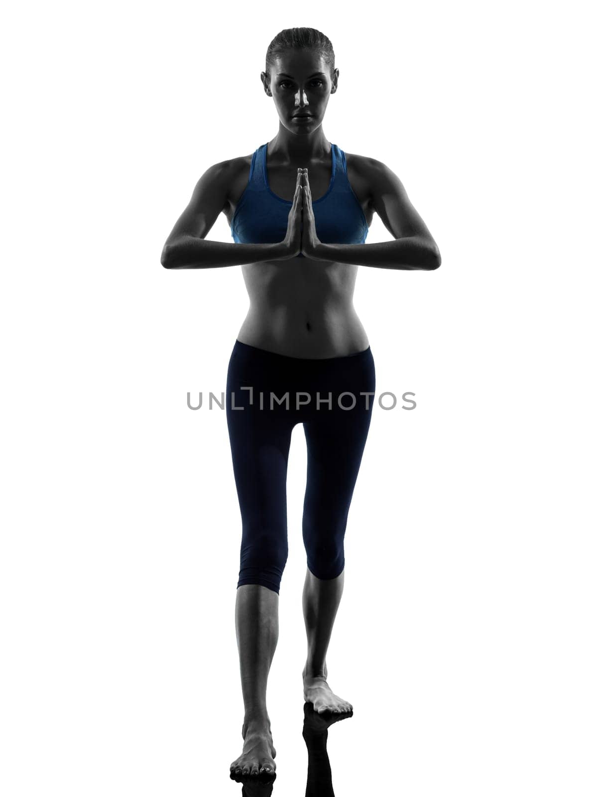 one caucasian woman exercising yoga warrior position in silhouette studio isolated on white background