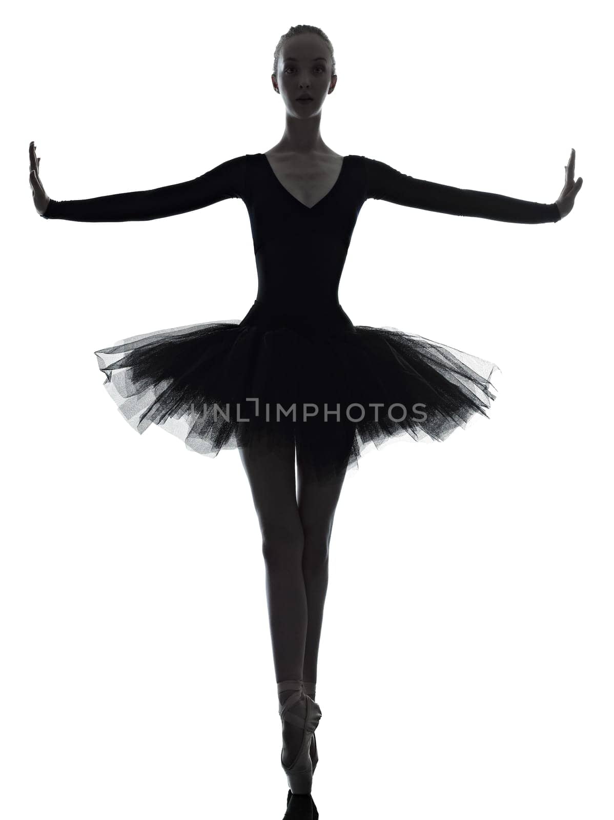 one caucasian young woman ballerina ballet dancer dancing with tutu in silhouette studio on white background