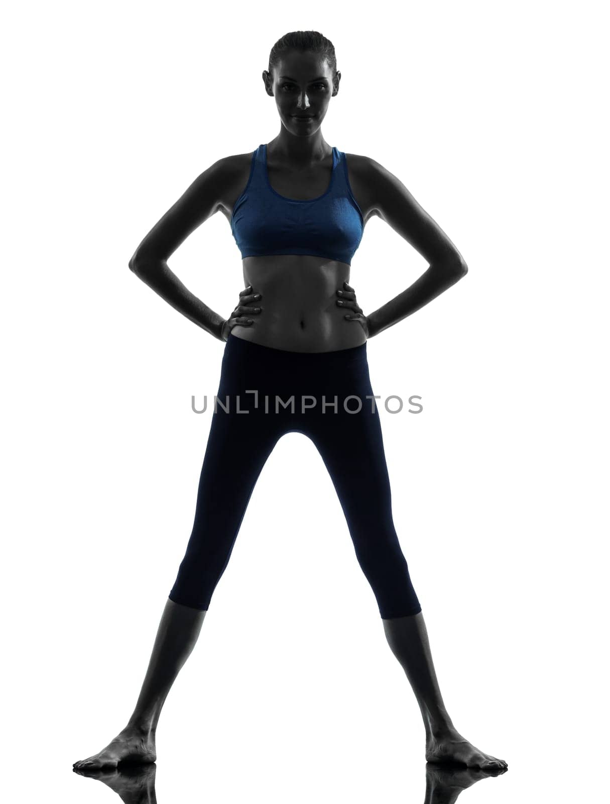 one caucasian woman exercising fitness standing in silhouette studio isolated on white background