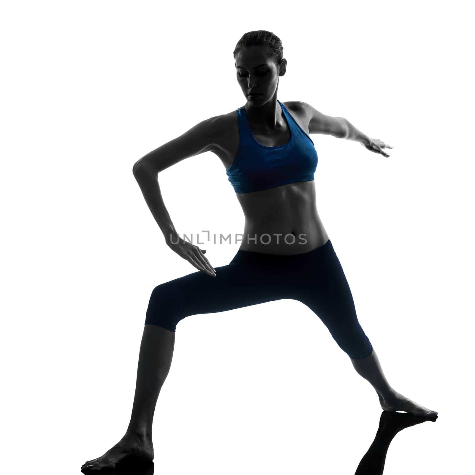 one caucasian woman exercising yoga in silhouette studio isolated on white background