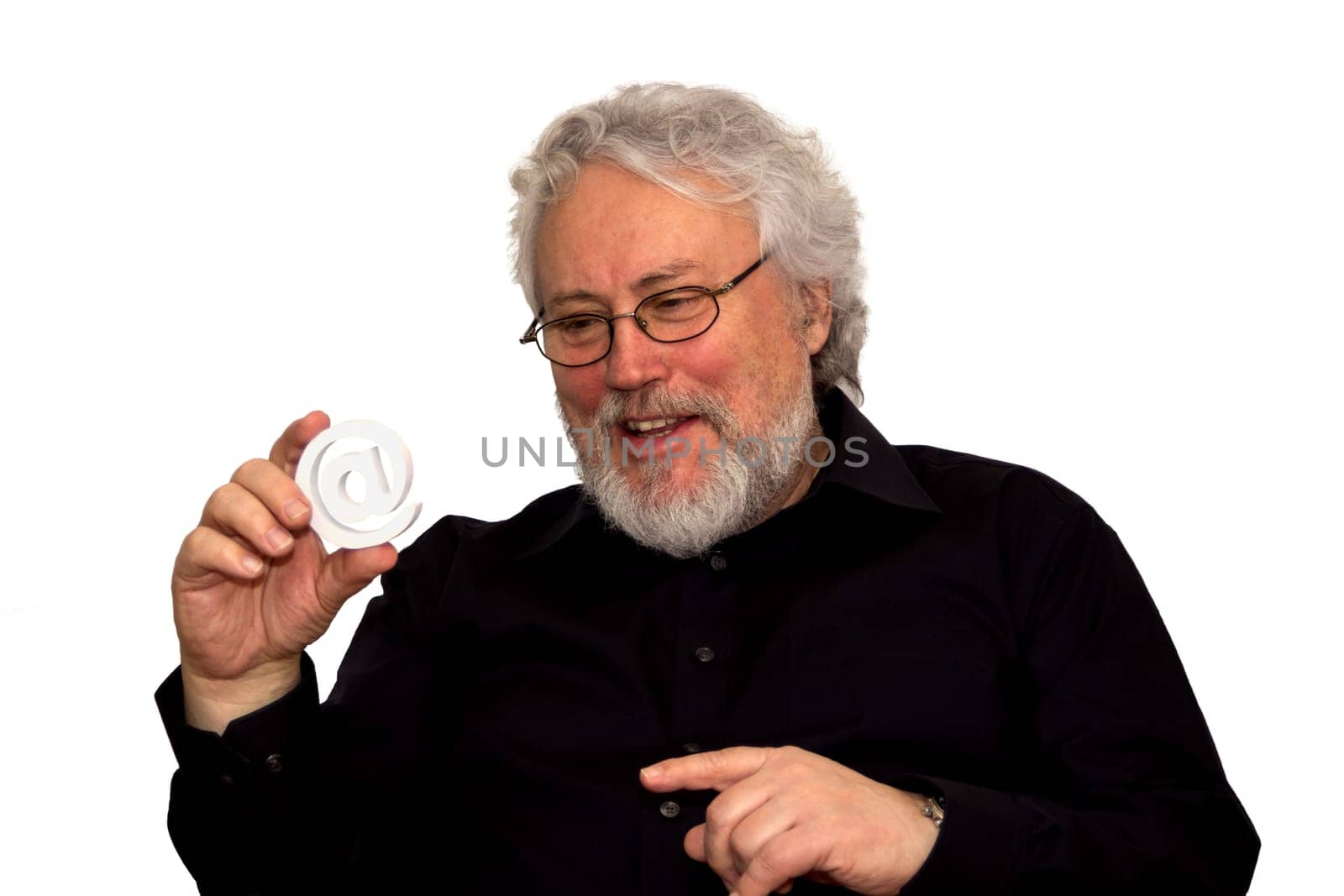 A senior is holding an at sign and laughing