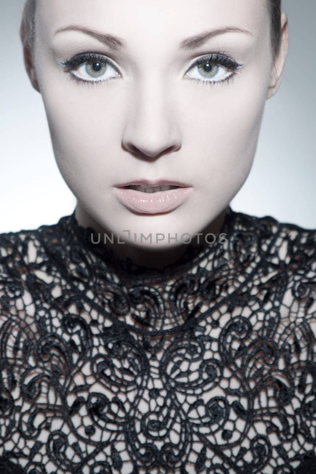 Beautiful young woman with evening dress and perfect makeup