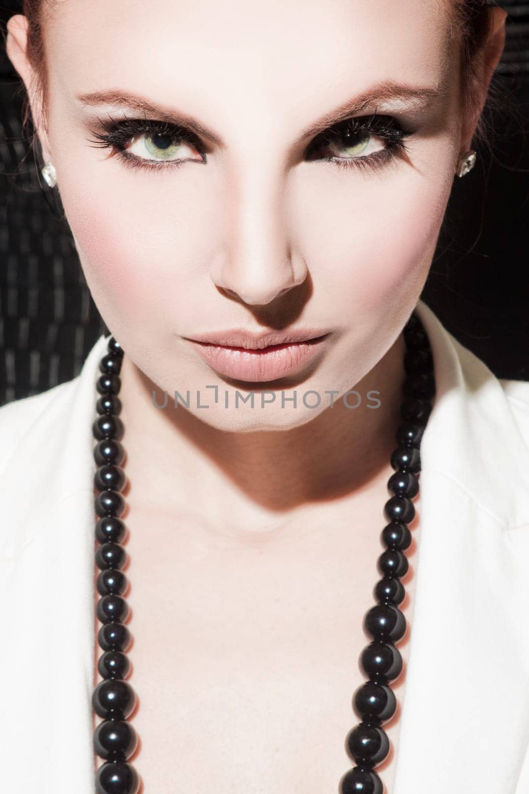 Beautiful young woman looking at camera