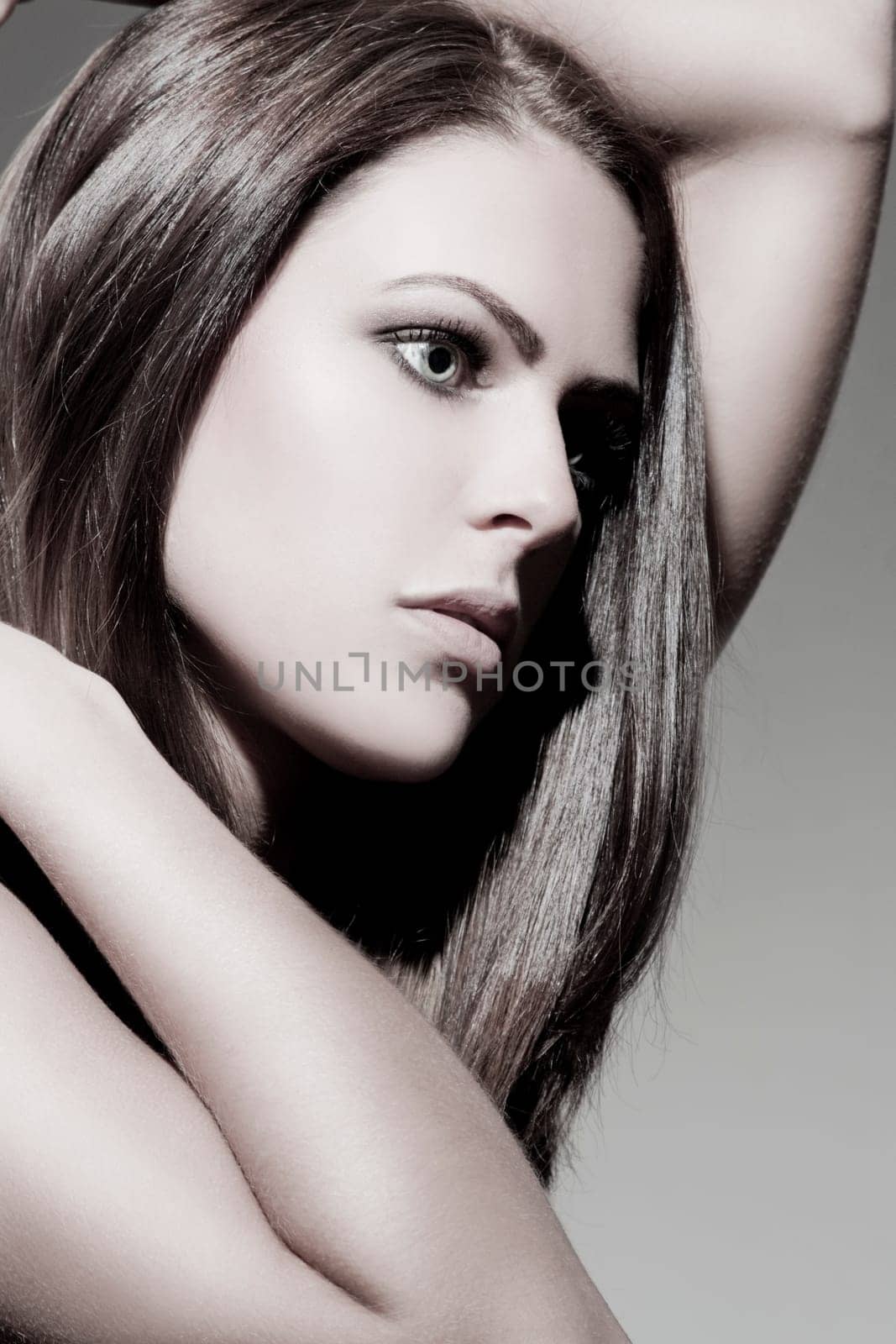 Beautiful young woman with shiny,healthy hair and perfect makeup
