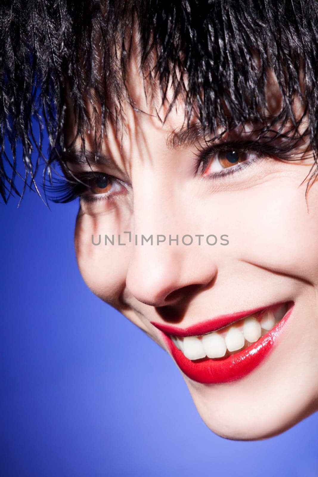 Beautiful young woman with perfect makeup and long eyelashes