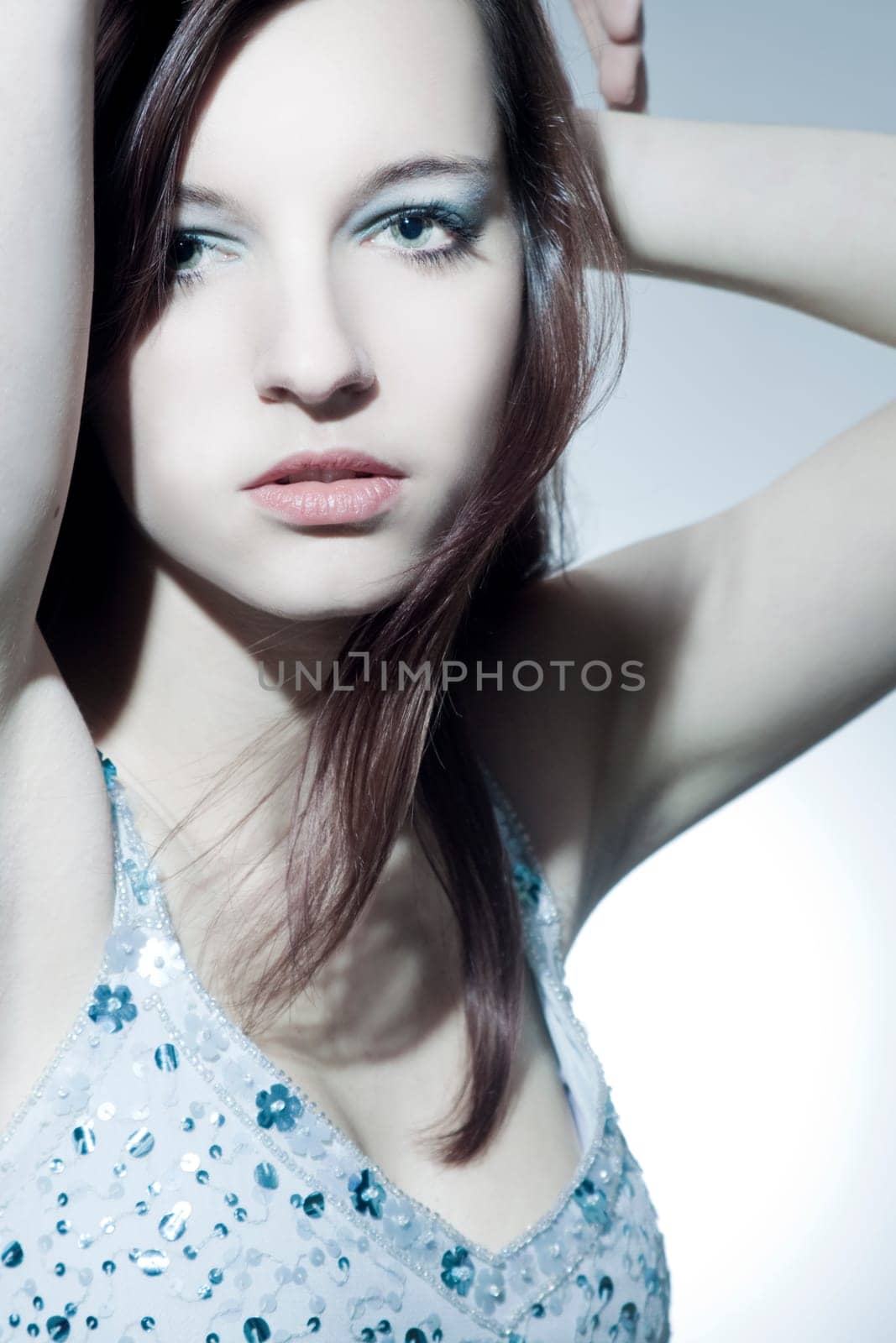 Beautiful young woman with healthy,shiny hair and makeup