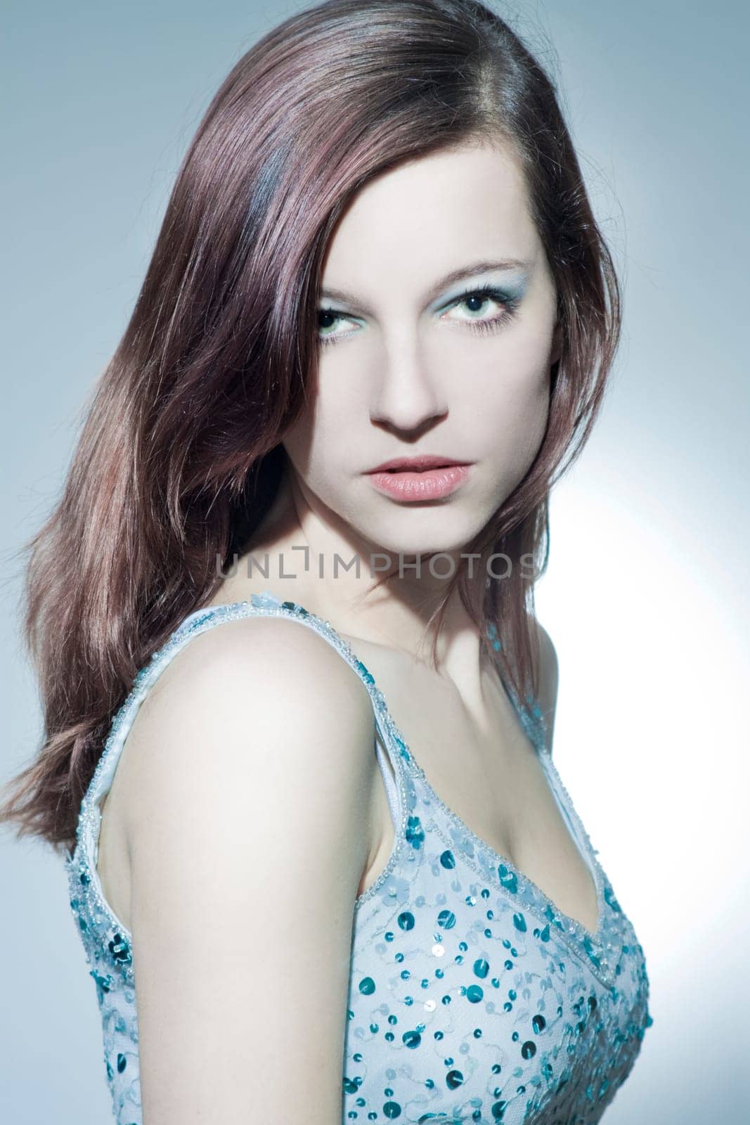 Beautiful young woman with healthy,shiny hair and makeup