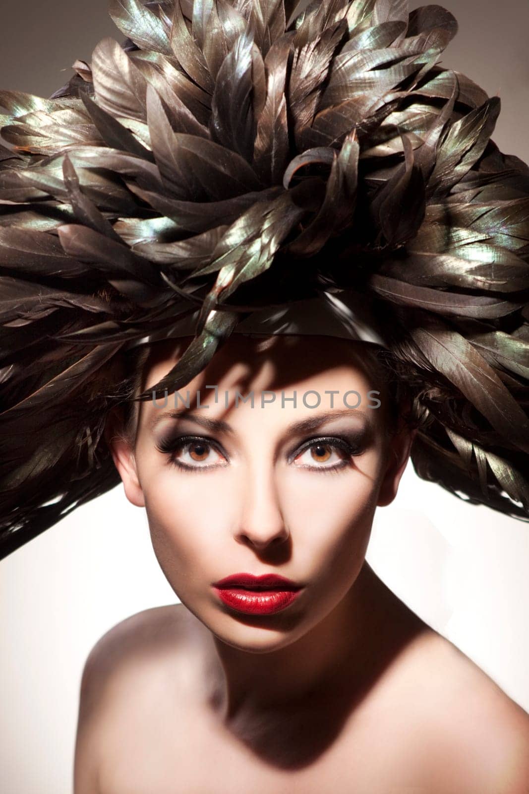 Young,beautiful woman with feathered hat