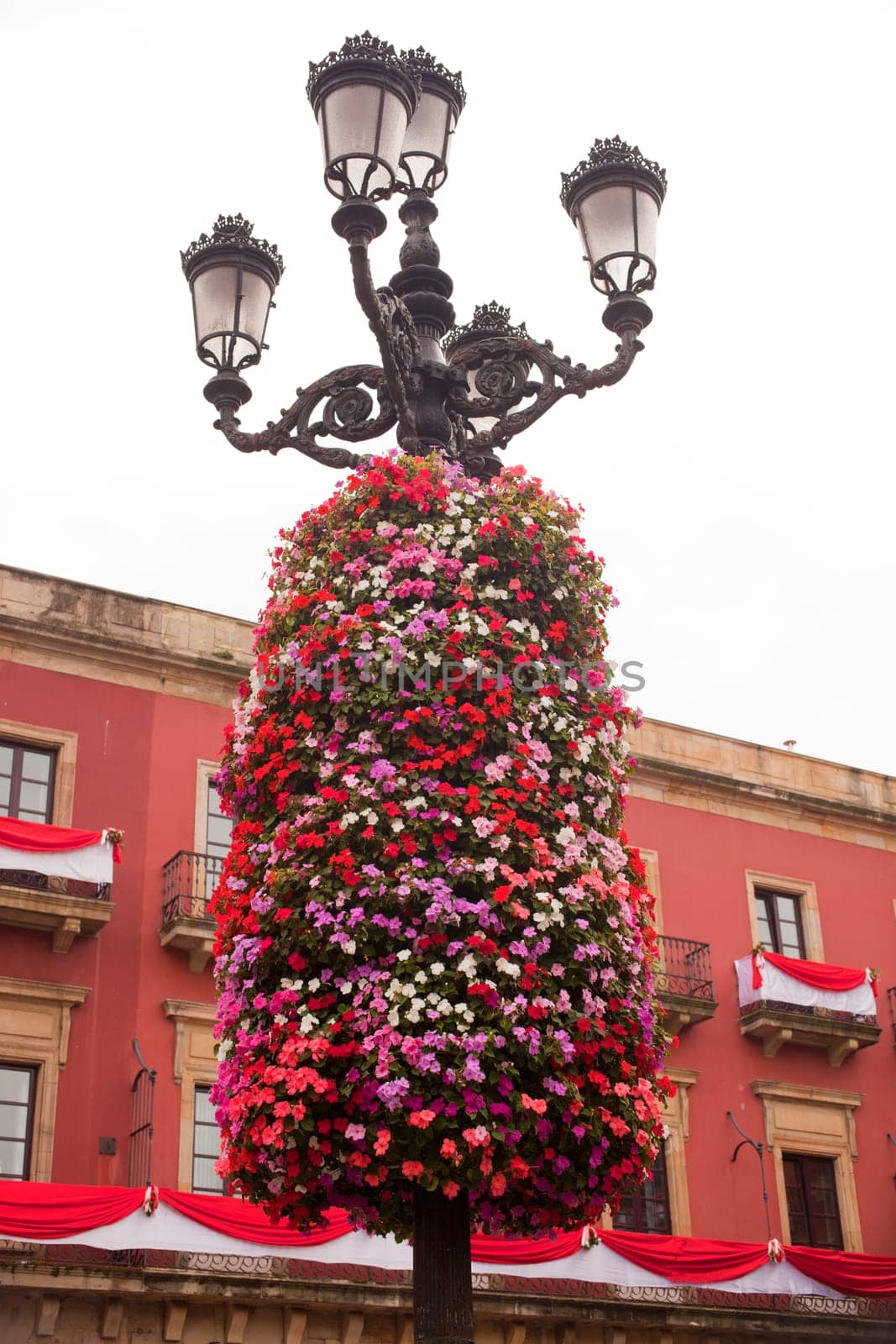 Flower decoration on a street light in Gijon, Asturias