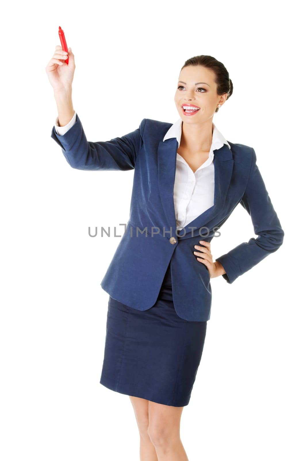 Young businesswoman writing something on abstract screen
