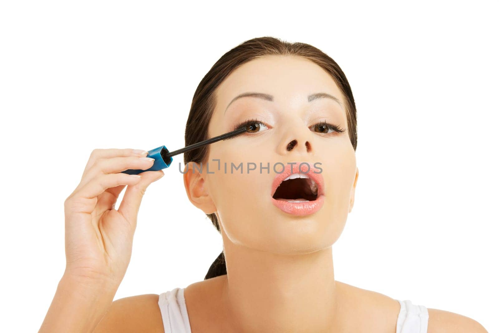 Close up of woman face with mascara brush