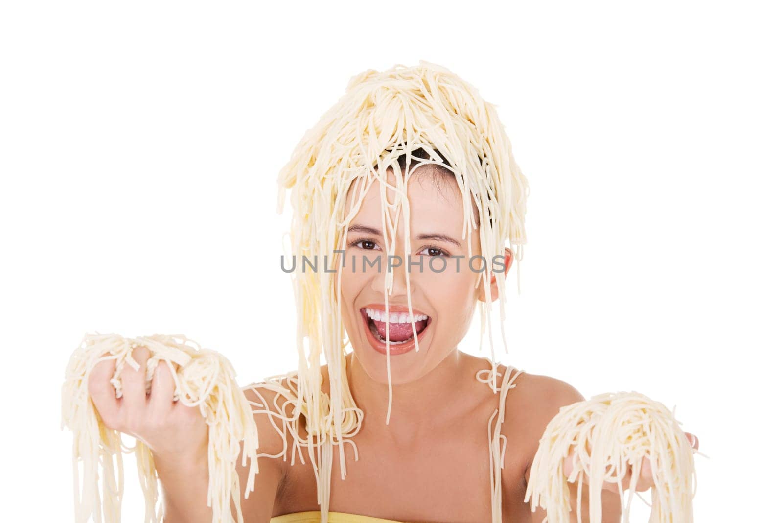 Young beautiful woman with spaghetti noodles on her hairs