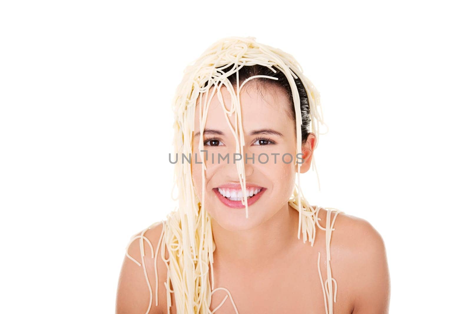 Young beautiful woman with spaghetti noodles on her hairs
