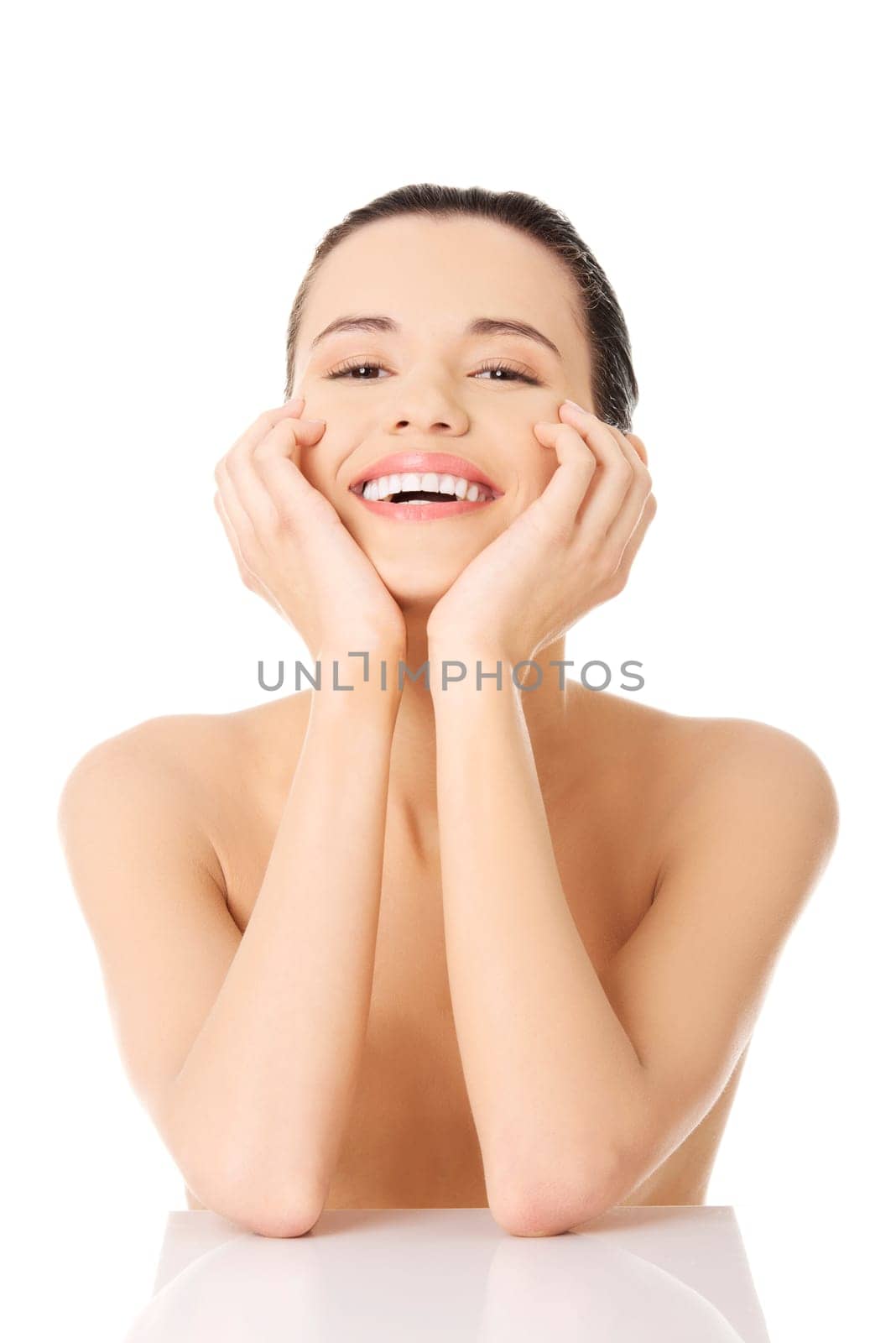 Portrait of a beautiful happy female model on white background