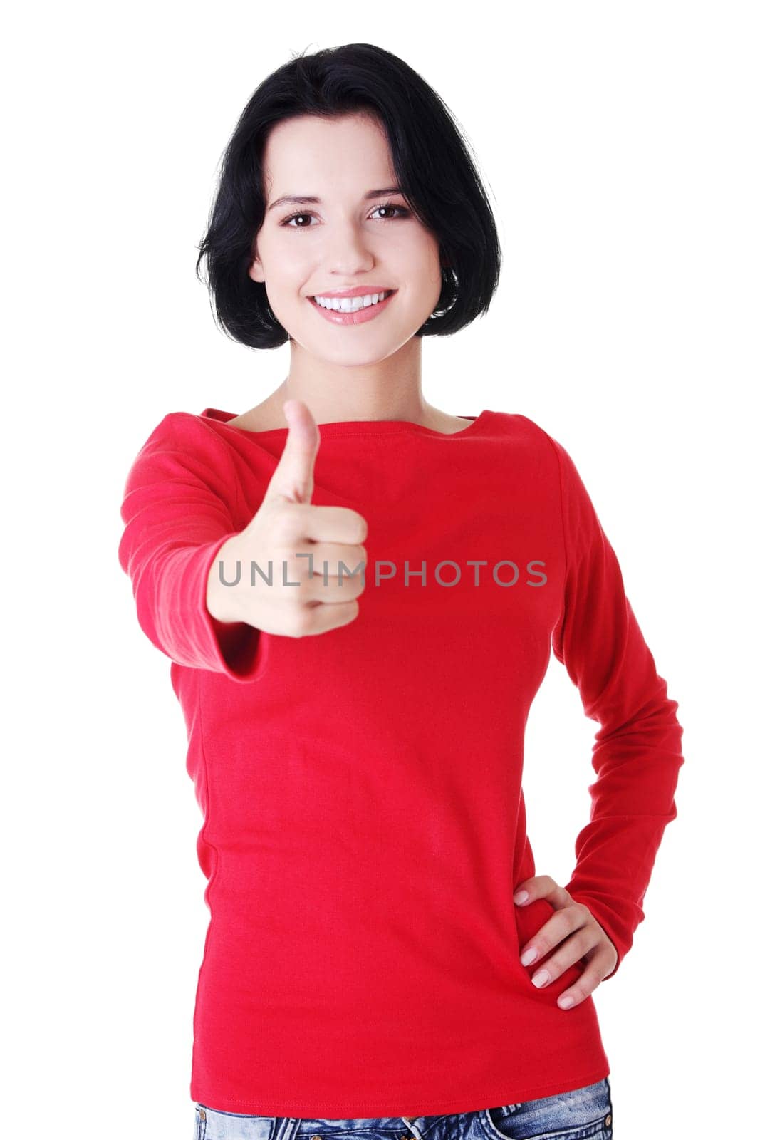 Attractive young student woman gesturing OK, isolated on white